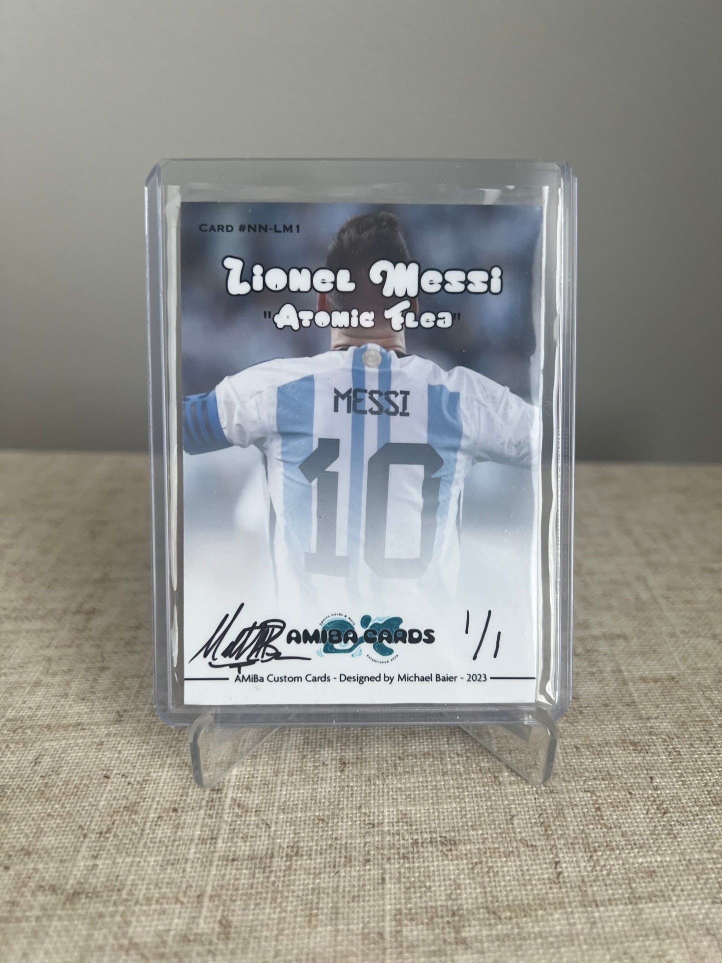 SPORTS NICKNAME SERIES - Lionel Messi "THE ATOMIC FLEA" - HOLOGRAPHIC ATOMIC ICE PARALLEL - Soccer - Custom Art Trading Card - 2021 - 1/1 Trading Card - Designed by AMiBa Cards
